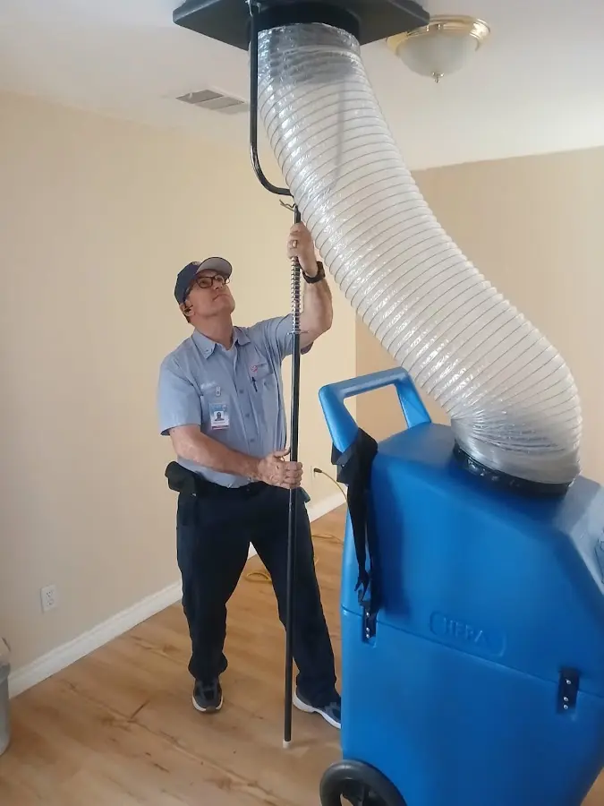 Furnace Tune-Up technician using HEPA equipment in Oak Ridge